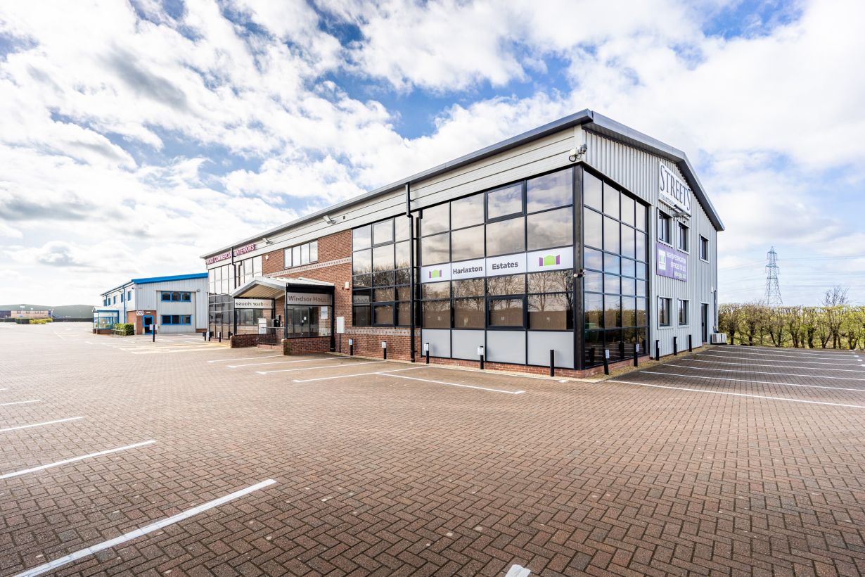 Stylish and contemporary office lounge in Harlaxton House with vibrant decor, natural light, and comfortable seating, designed to foster creativity and collaboration among professionals in the East Midlands.